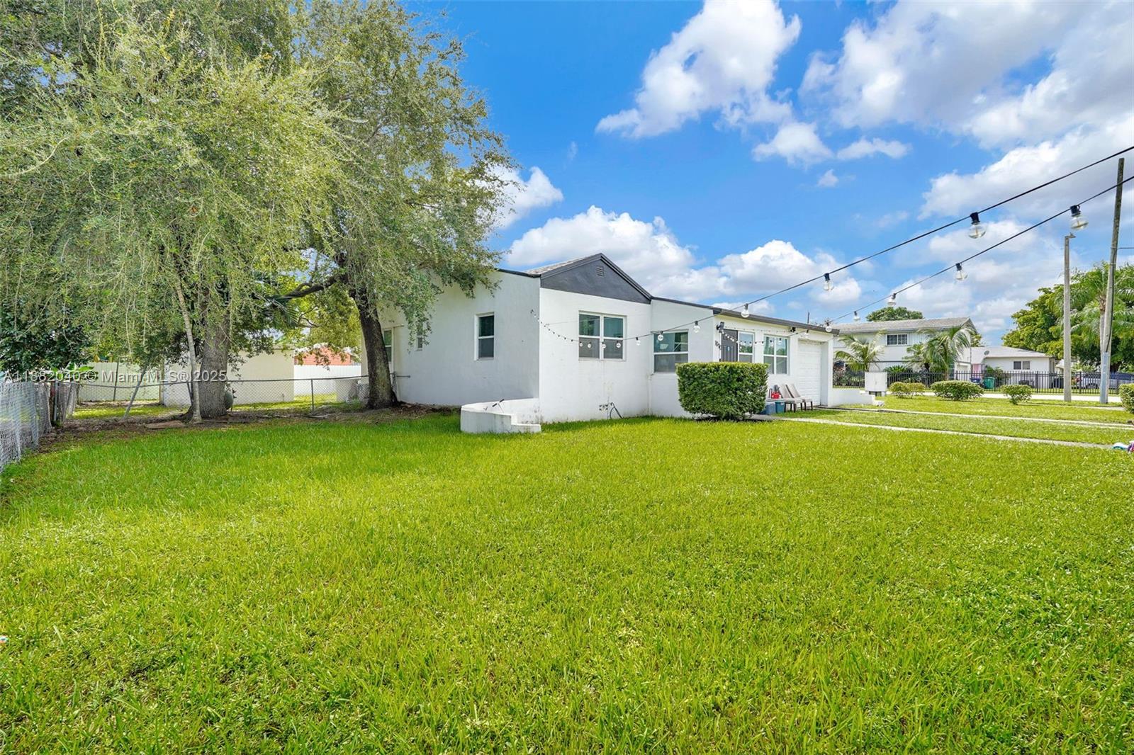 1090 Northwest 77th Street Miami, FL 33150 - Photo 14 of 77 a front view of house with yard and green space