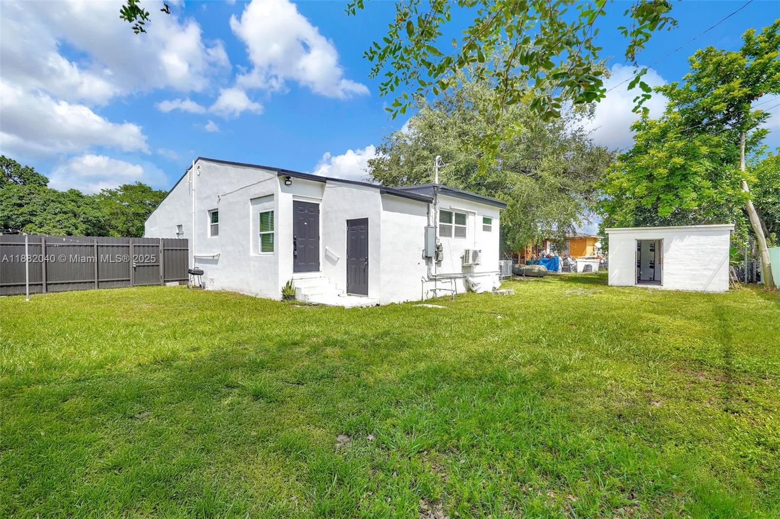 1090 Northwest 77th Street Miami, FL 33150 - Photo 15 of 77 a view of a house with backyard and garden