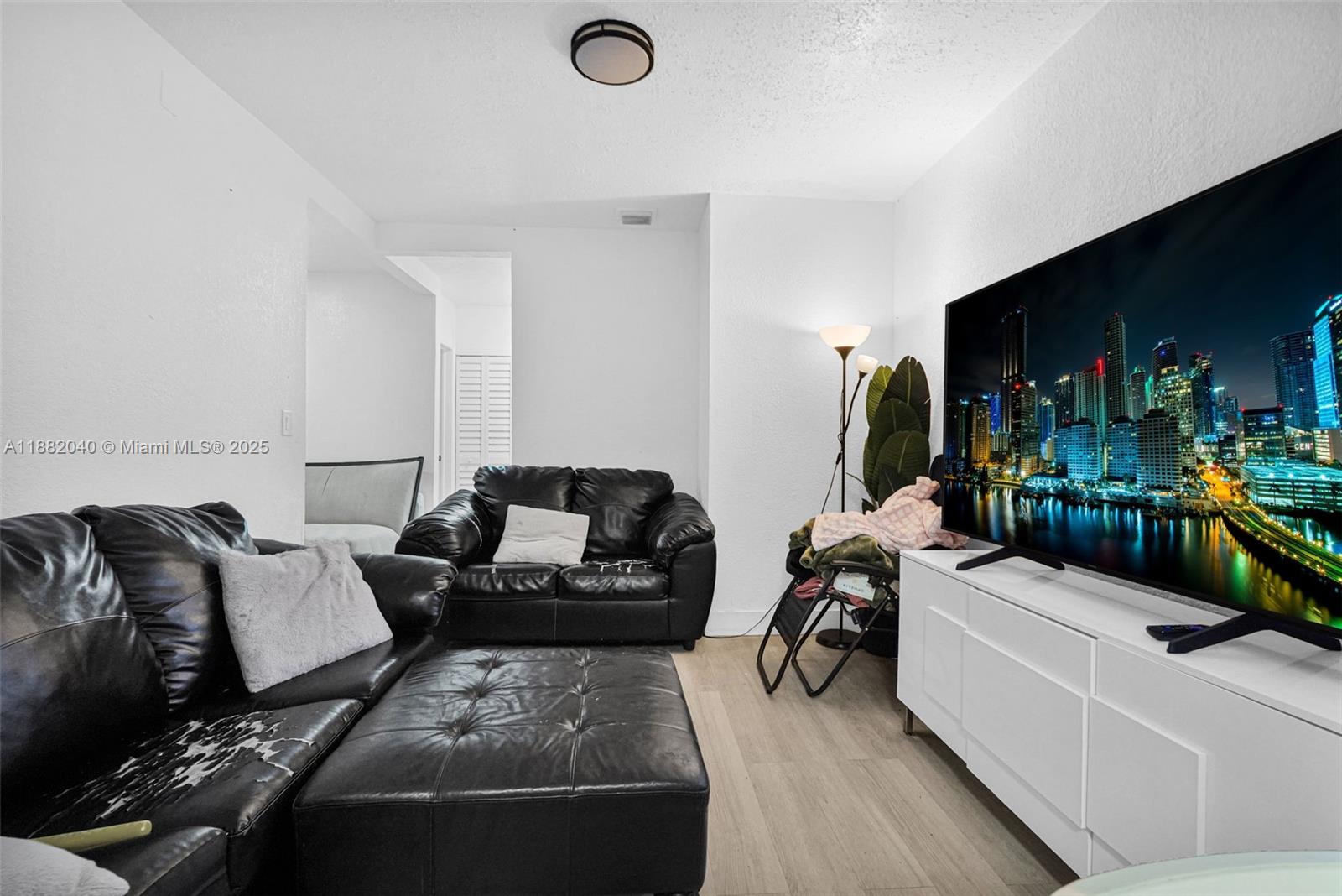 1090 Northwest 77th Street Miami, FL 33150 - Photo 21 of 77 a living room with furniture and a couch