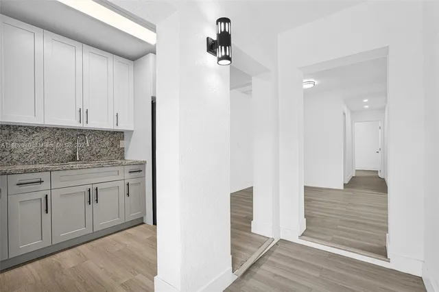 a kitchen with a refrigerator stove and microwave