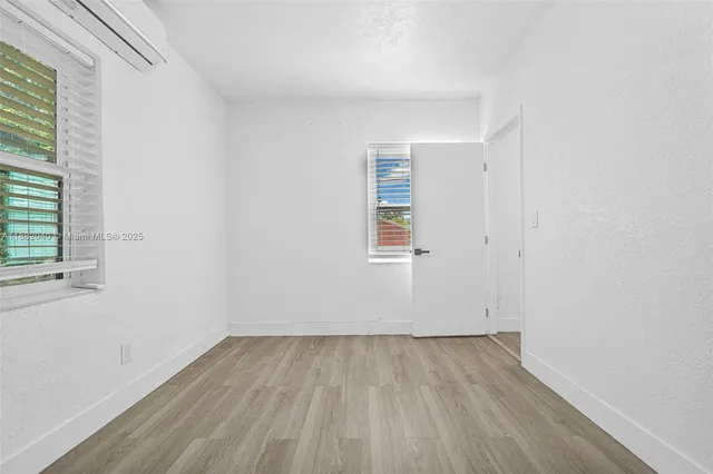 a kitchen with stainless steel appliances granite countertop a refrigerator and a stove