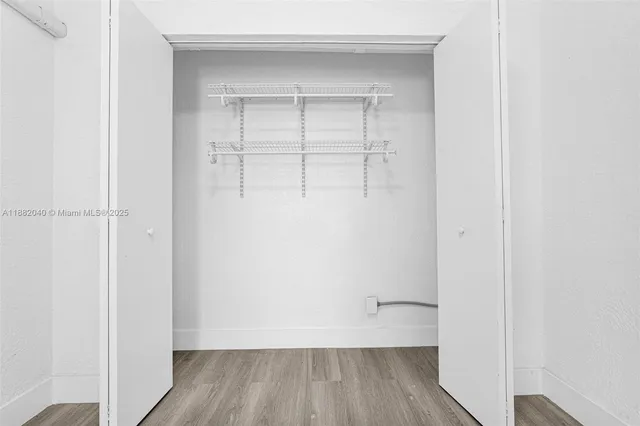 a kitchen with stainless steel appliances granite countertop a stove and a refrigerator