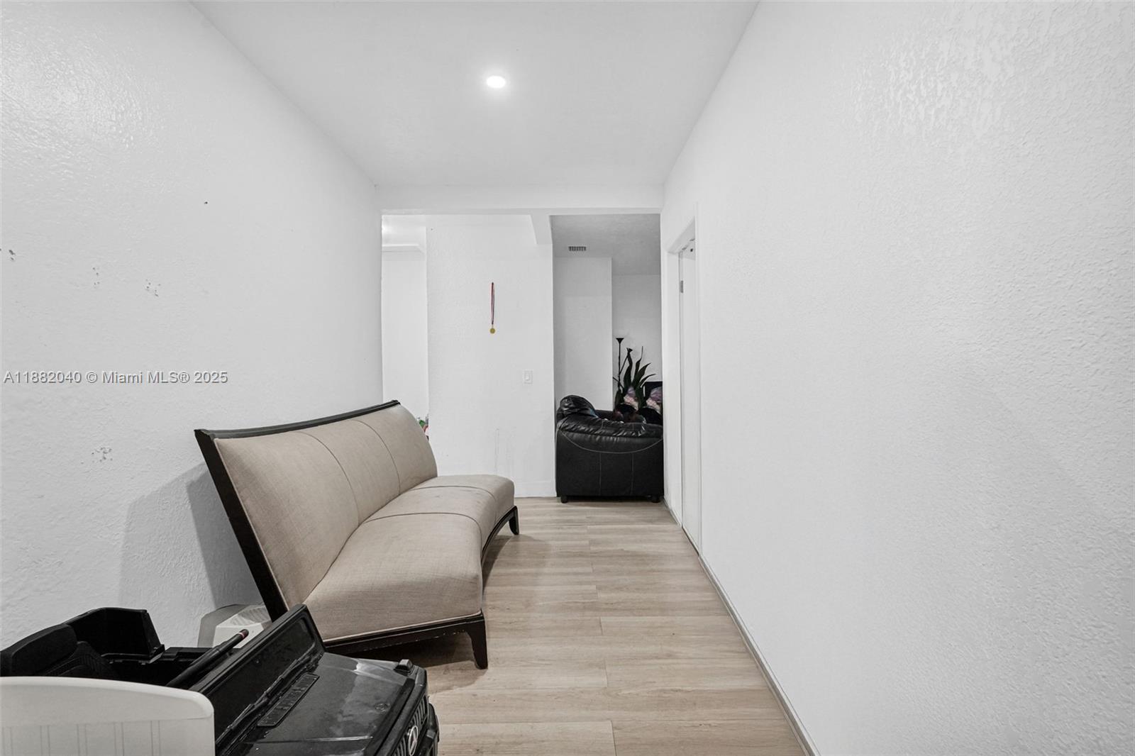 1090 Northwest 77th Street Miami, FL 33150 - Photo 48 of 77 a living room with furniture and a wooden floor