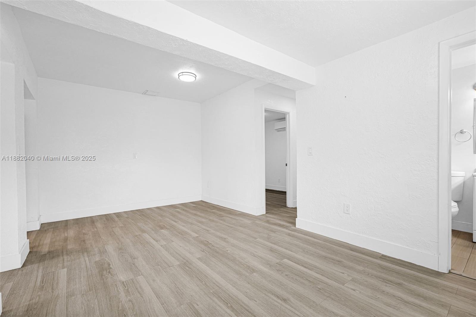 1090 Northwest 77th Street Miami, FL 33150 - Photo 61 of 77 a view of an empty room with wooden floor