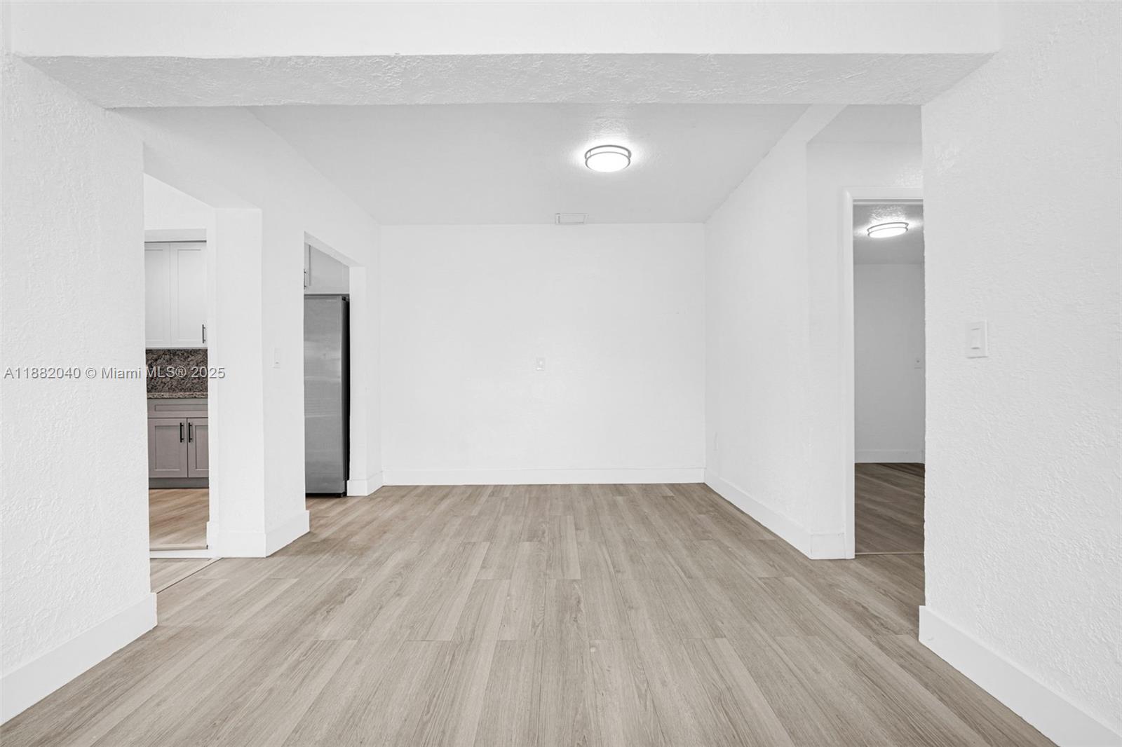 1090 Northwest 77th Street Miami, FL 33150 - Photo 62 of 77 a view of an empty room with wooden floor