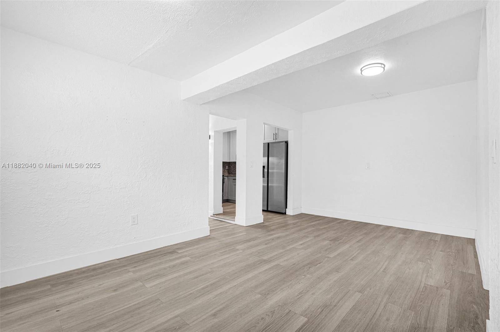 1090 Northwest 77th Street Miami, FL 33150 - Photo 63 of 77 a view of an empty room with wooden floor