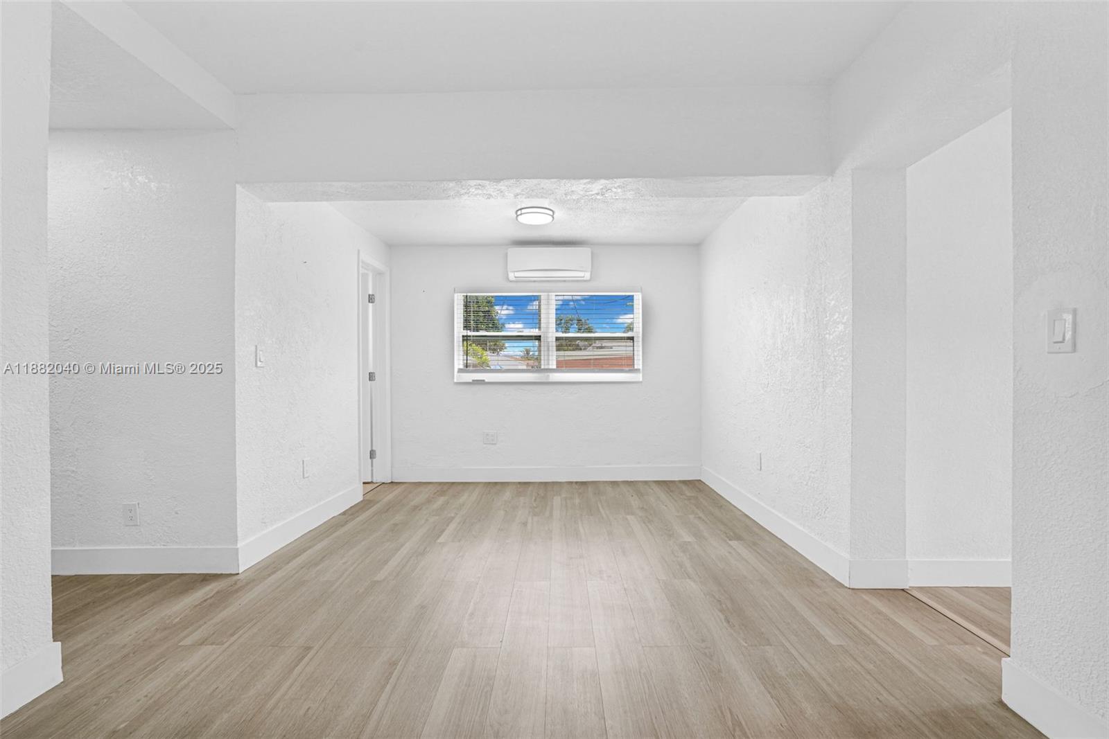 1090 Northwest 77th Street Miami, FL 33150 - Photo 73 of 77 an empty room with wooden floor and windows