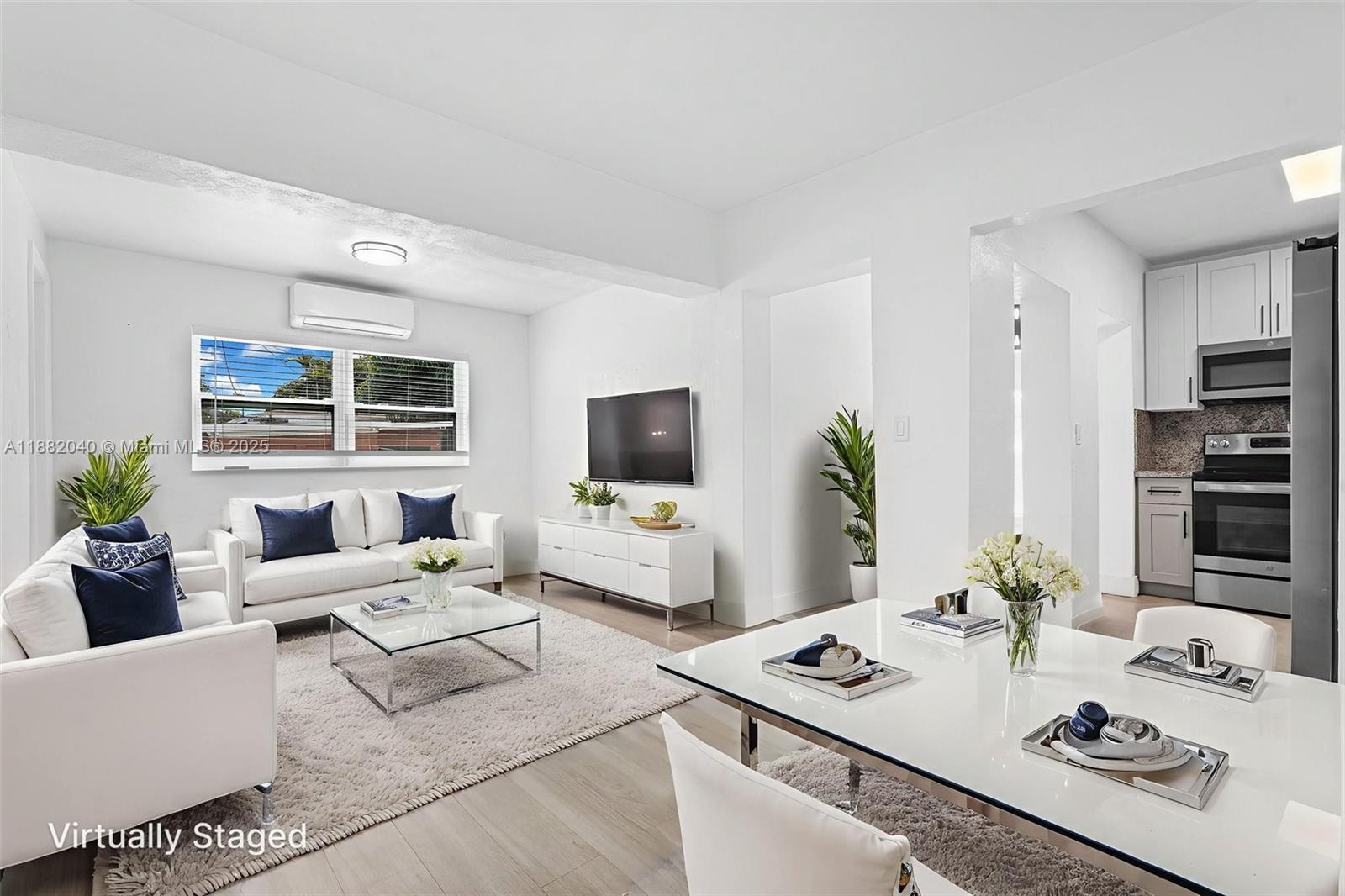 1090 Northwest 77th Street Miami, FL 33150 - Photo 75 of 77 a living room with furniture and a flat screen tv