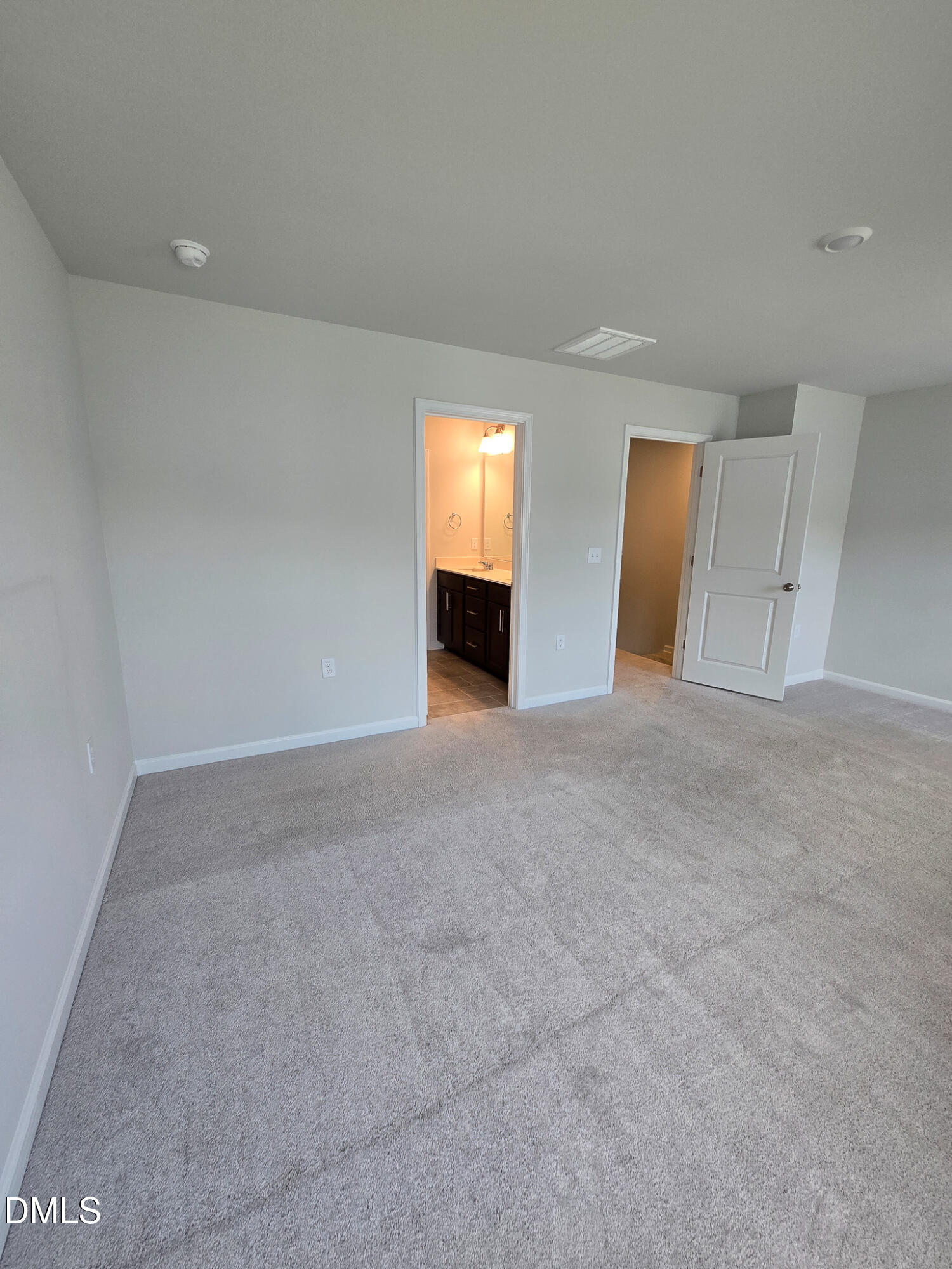 2431 Kasota Lane Raleigh, NC 27610 - Photo 30 of 46 an empty room with windows and fireplace