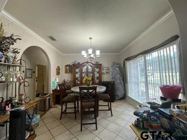 a view of a livingroom with furniture and a window
