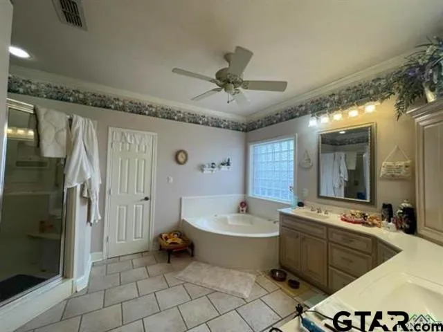 a bedroom with a bed and a tv