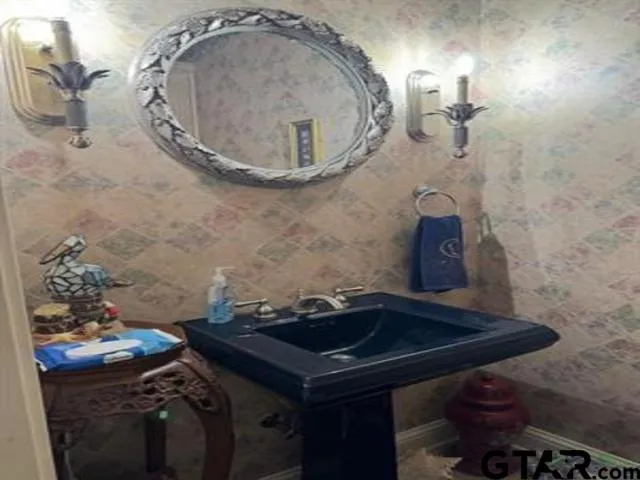 a front view of a house with a yard and a garage