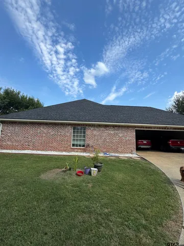 a view of a park with large trees