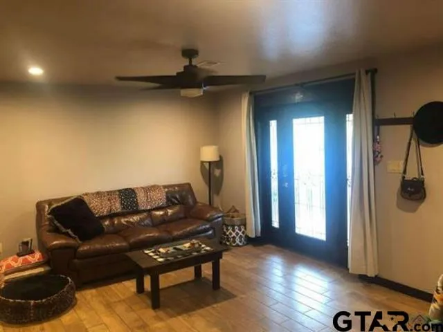 a kitchen with stainless steel appliances granite countertop a refrigerator stove and sink