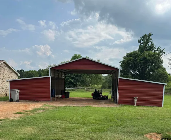 a view of a yard in front of a house with a yard