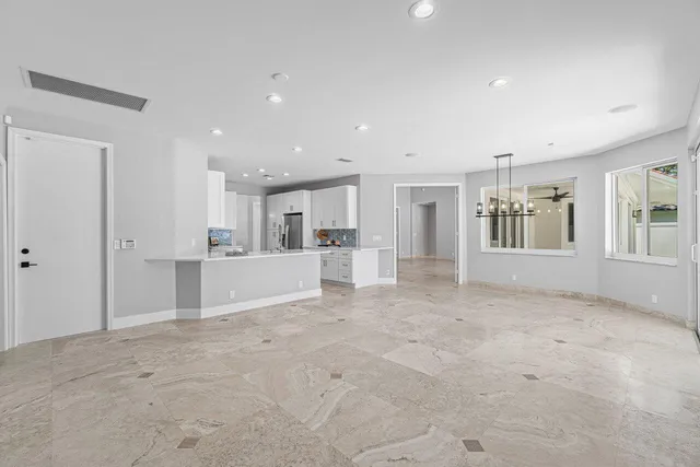 a kitchen with a sink and a refrigerator