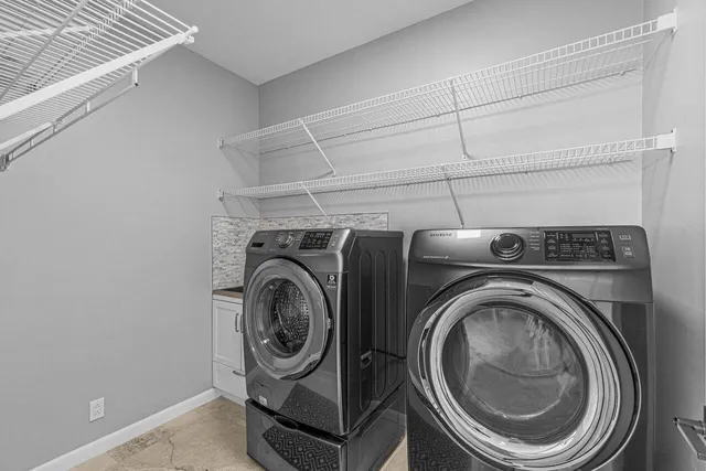 an empty room with windows and outdoor view