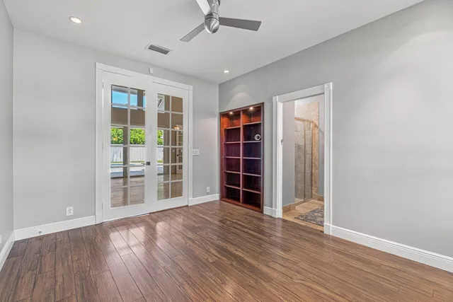 a bathroom with a sink mirror and toilet