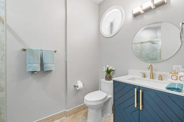 a bathroom with a shower and a sink