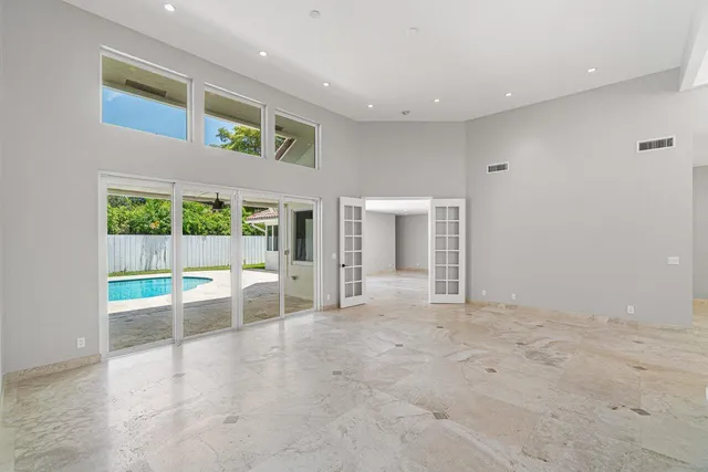 a view of an empty room with a fireplace