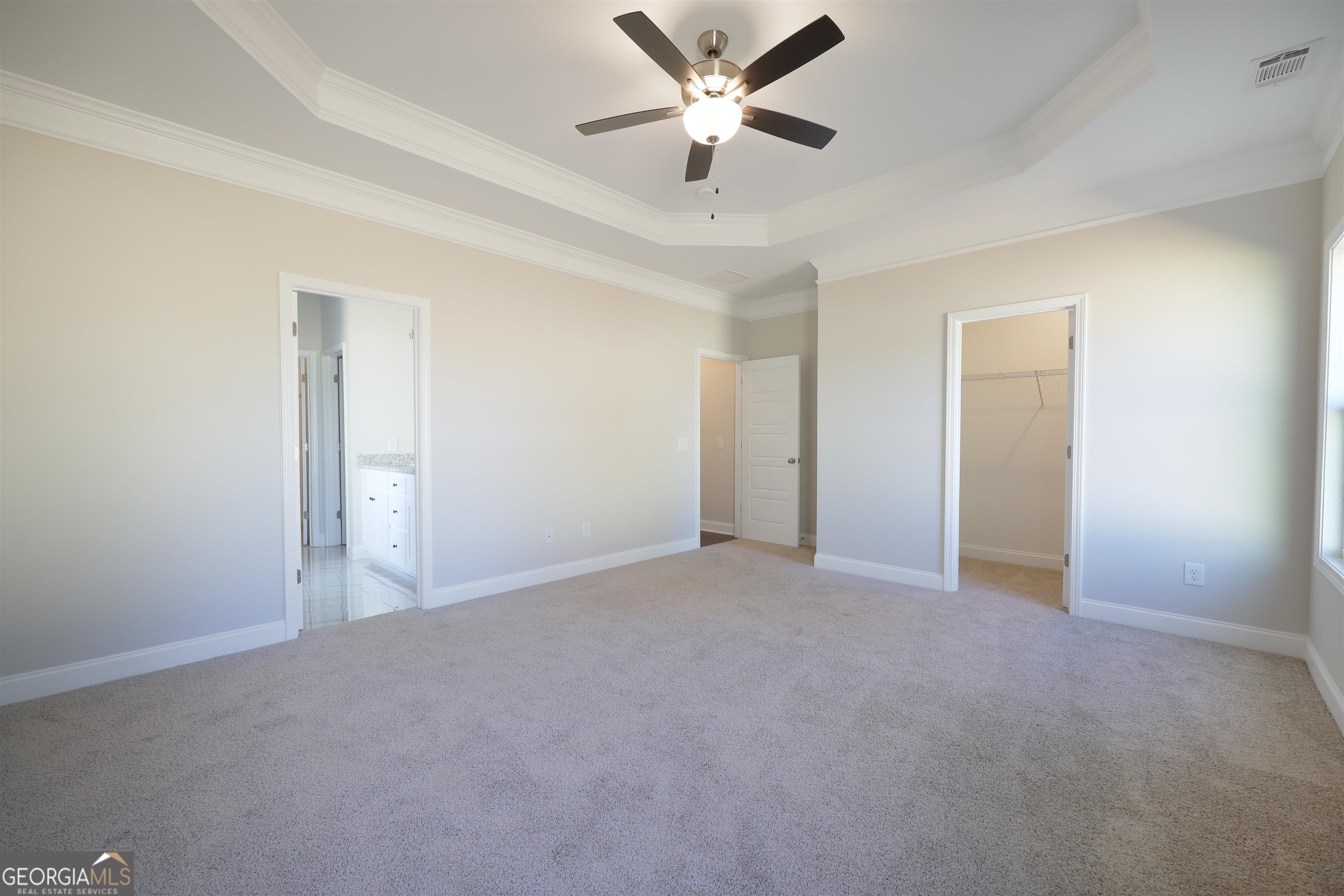 63 Delightful Way, Unit 1 Winder, GA 30680 - Photo 13 of 26 a view of an empty room and a ceiling fan