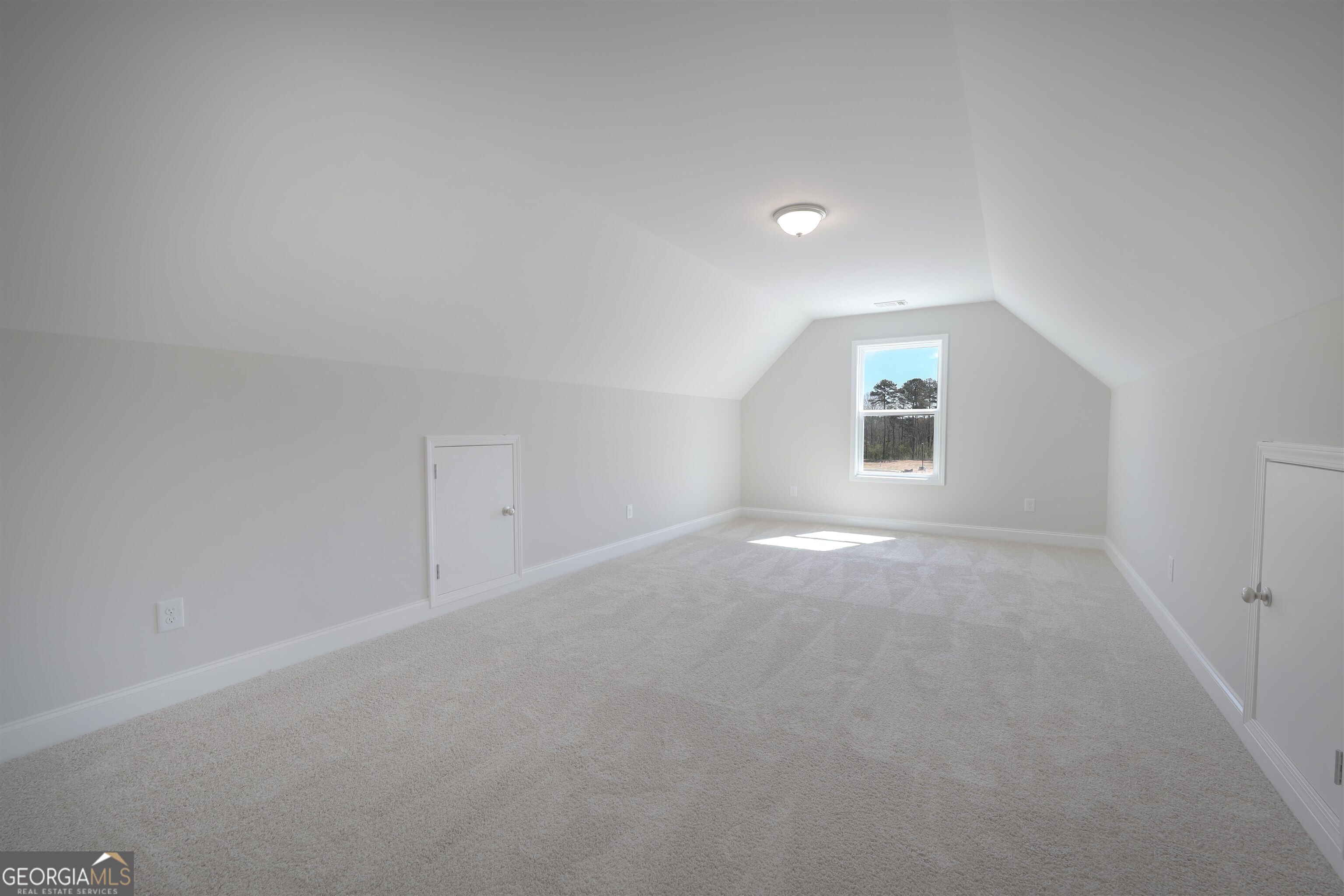63 Delightful Way, Unit 1 Winder, GA 30680 - Photo 20 of 26 an empty room with windows and closet