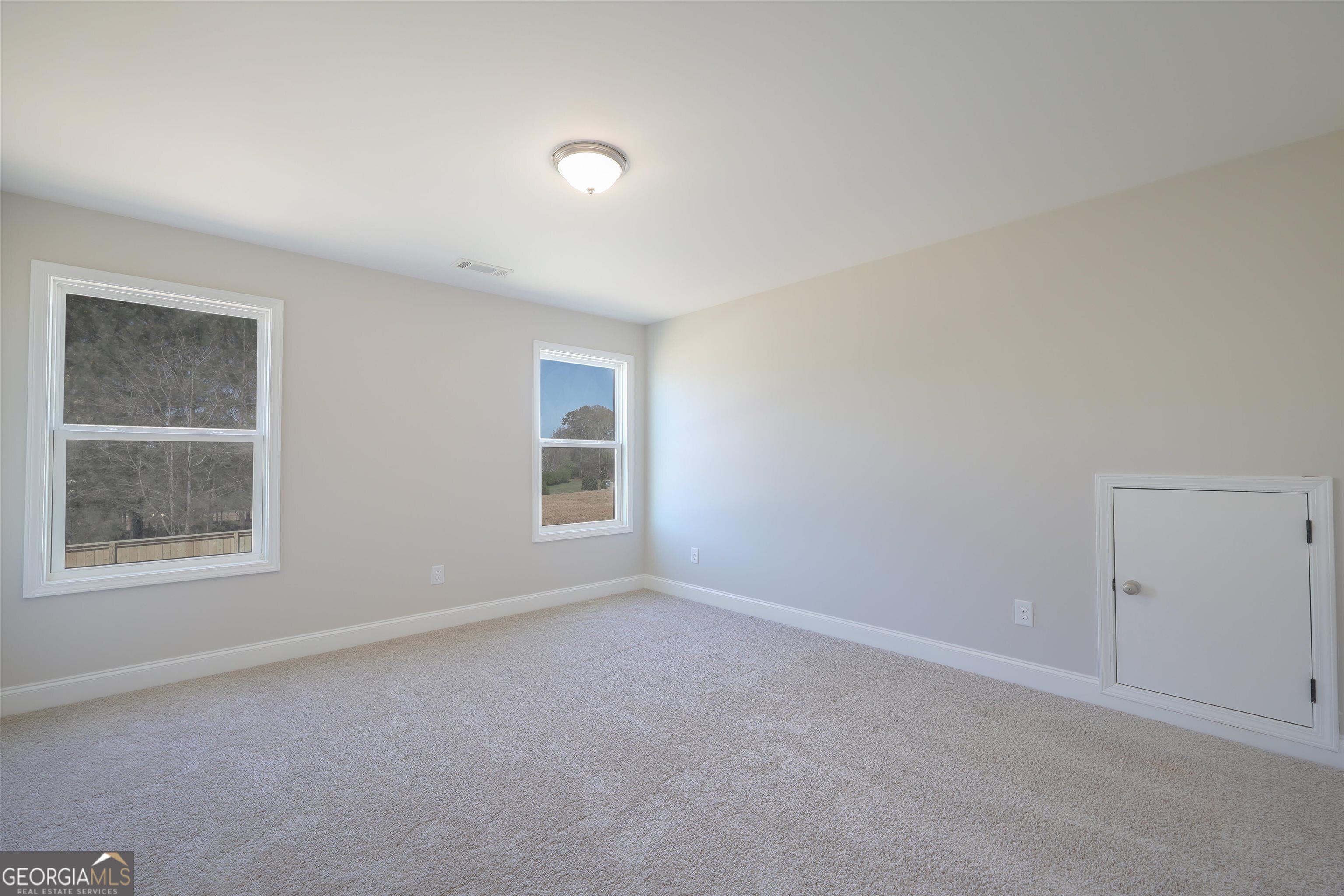 63 Delightful Way, Unit 1 Winder, GA 30680 - Photo 22 of 26 an empty room with a window