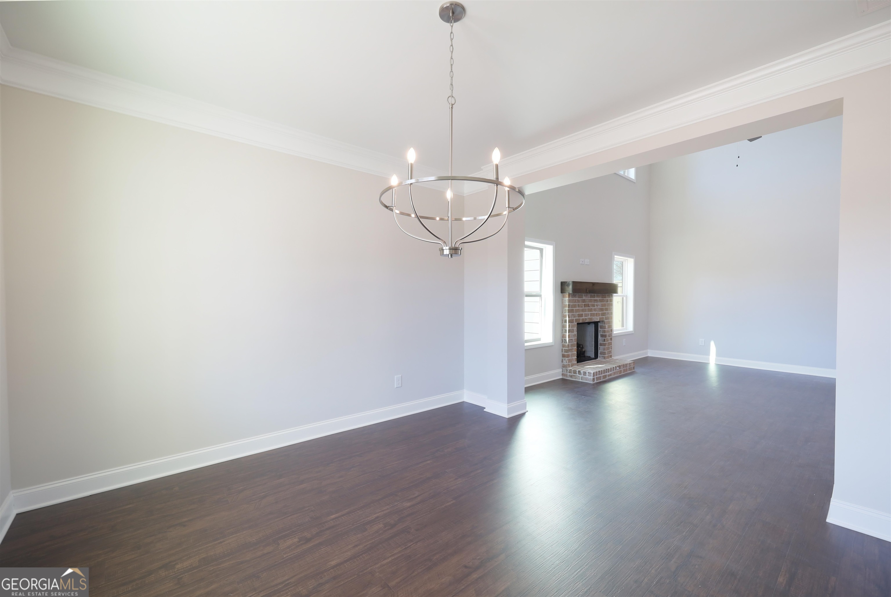 63 Delightful Way, Unit 1 Winder, GA 30680 - Photo 3 of 26 a view of a room with wooden floor and a window