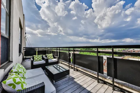 a view of swimming pool with seating area
