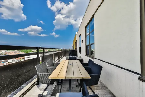 a balcony with view of outdoor space