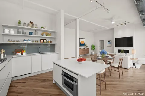 a view of living room with furniture and flat screen tv