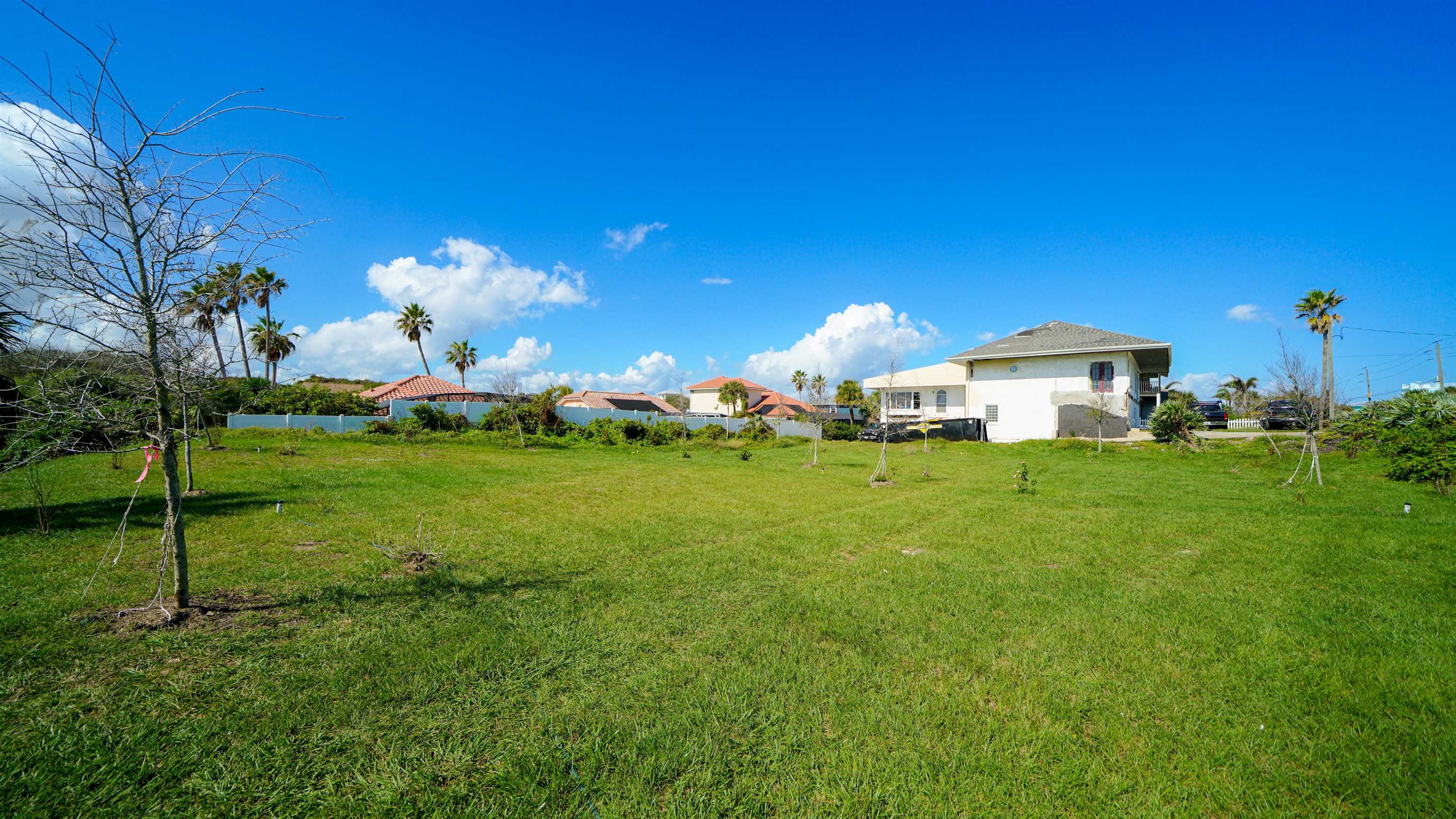 4738 South Atlantic Avenue Ponce Inlet, FL 32127 - Photo 28 of 32 a front view of a house with garden