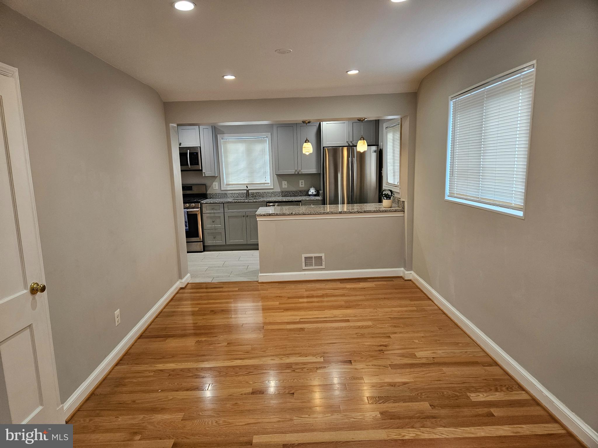 11102 Bucknell Drive Silver Spring, MD 20902 - Photo 4 of 14 a view of kitchen and wooden floor