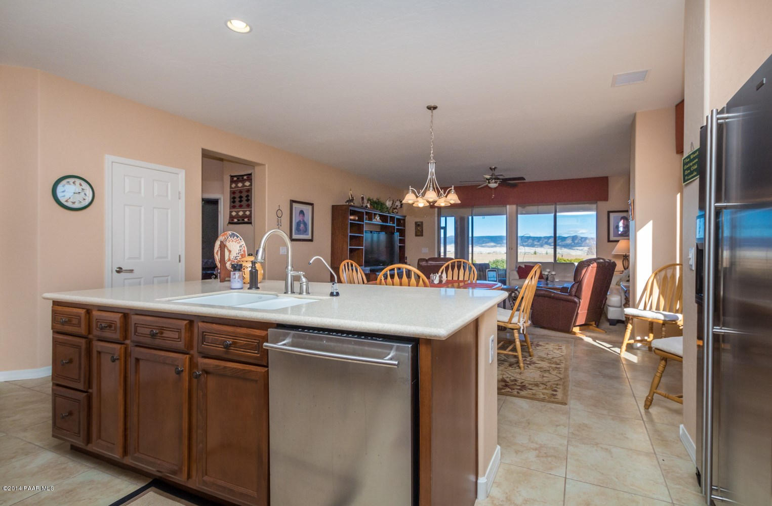 1229 Rusty Nail Road Prescott Valley, AZ 86314 - Photo 9 of 25 a kitchen with stainless steel appliances granite countertop a sink and a refrigerator