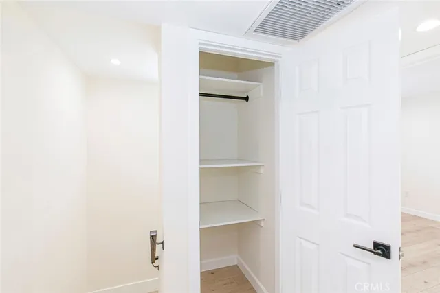 a view of an empty walk in closet