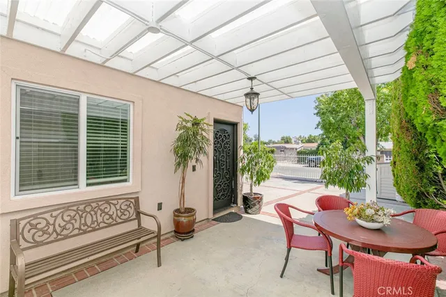 a outdoor living space with furniture and a ceiling fan