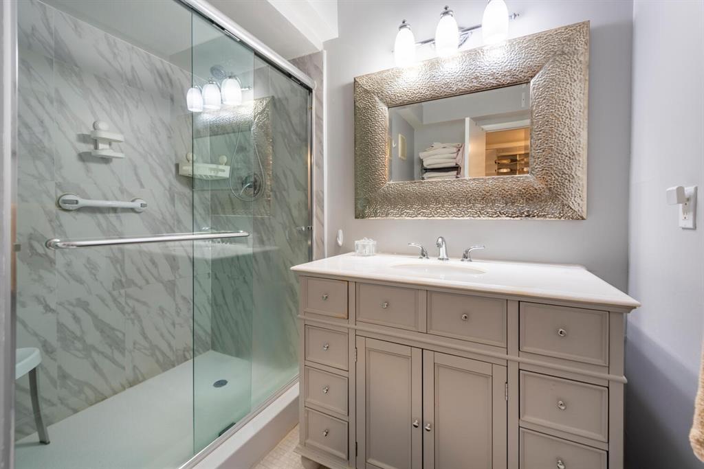 16251 Golf Club Road, Unit 305 Weston, FL 33326 - Photo 12 of 43 a bathroom with a sink a shower and a mirror
