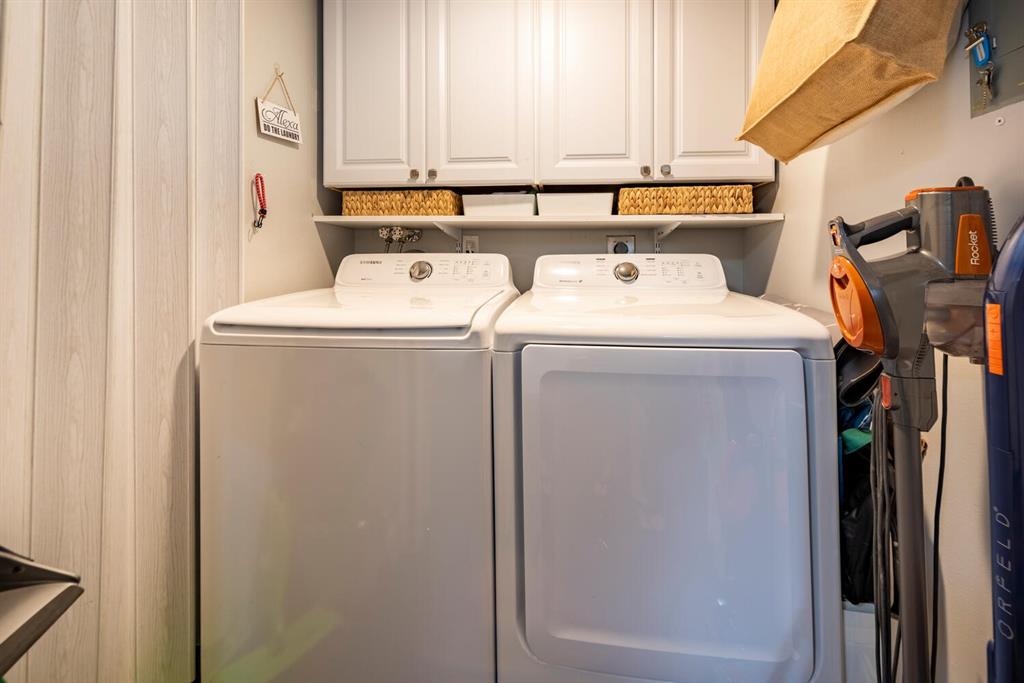 16251 Golf Club Road, Unit 305 Weston, FL 33326 - Photo 15 of 43 a utility room with dryer and washer