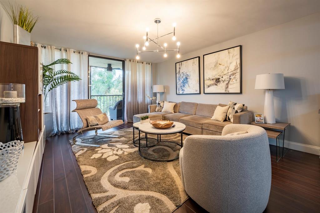 16251 Golf Club Road, Unit 305 Weston, FL 33326 - Photo 16 of 43 a living room with fireplace furniture and a flat screen tv