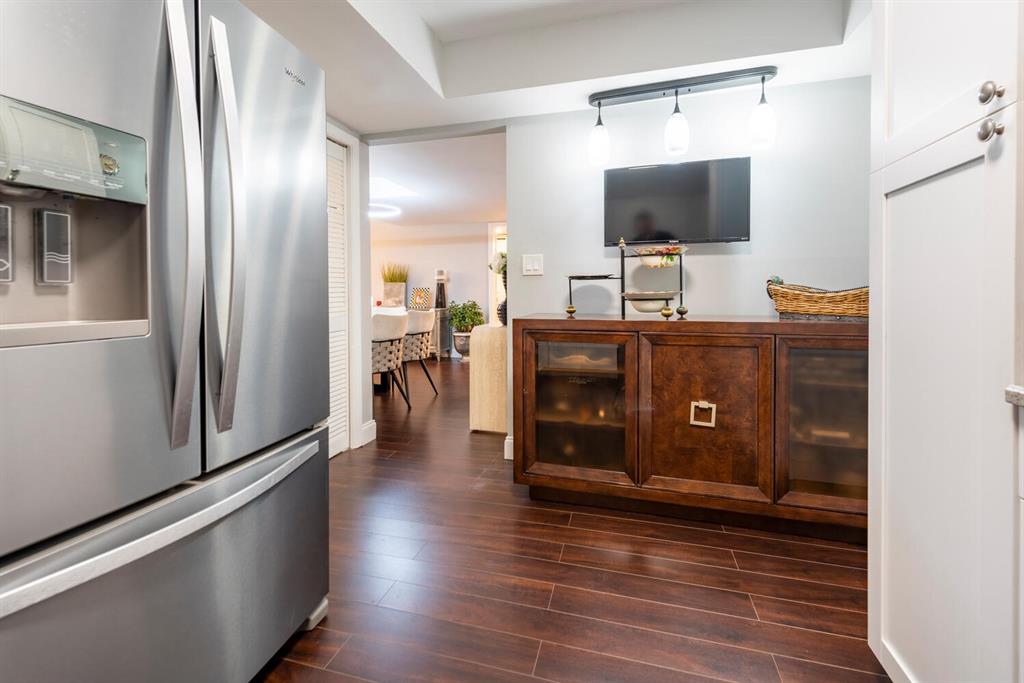 16251 Golf Club Road, Unit 305 Weston, FL 33326 - Photo 19 of 43 a living room with furniture and a flat screen tv