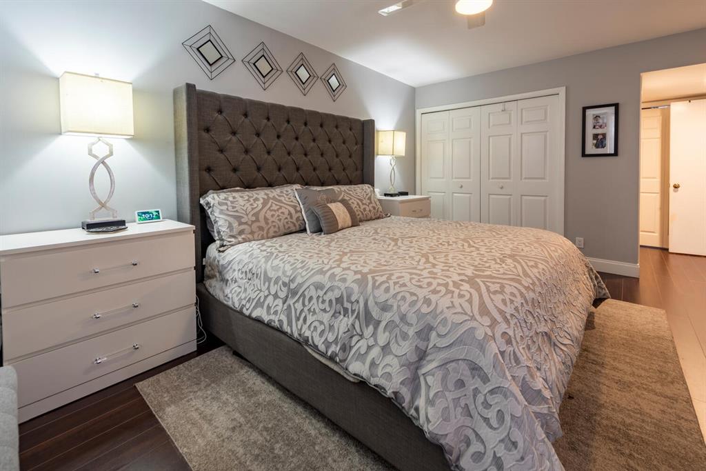 16251 Golf Club Road, Unit 305 Weston, FL 33326 - Photo 21 of 43 a large bed sitting in a bedroom next to a lamp