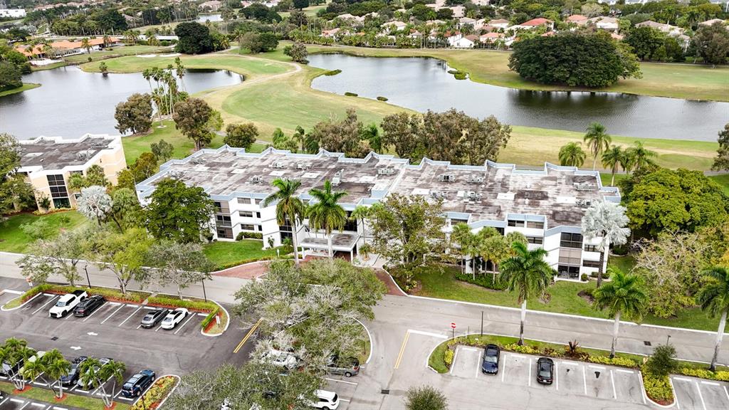 16251 Golf Club Road, Unit 305 Weston, FL 33326 - Photo 28 of 43 aerial view of a house with a lake view