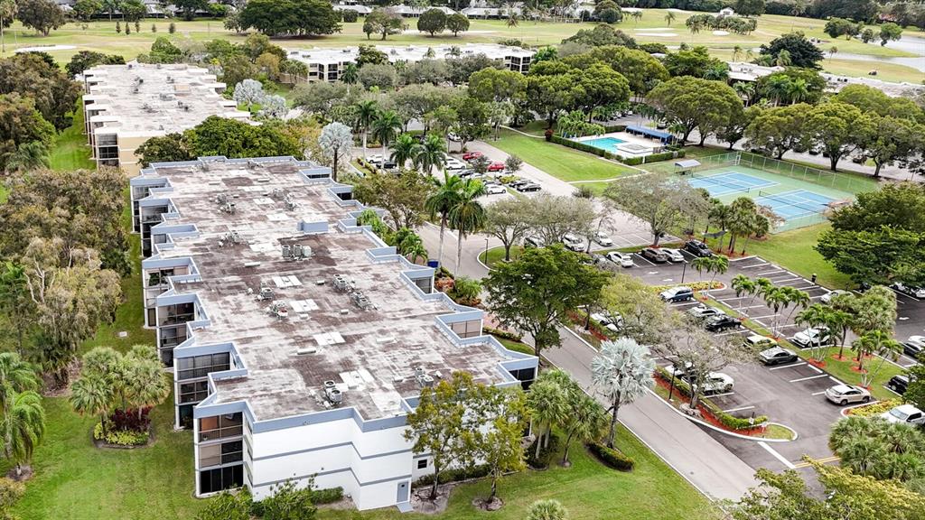 16251 Golf Club Road, Unit 305 Weston, FL 33326 - Photo 29 of 43 an aerial view of a house with a yard and lake view in back