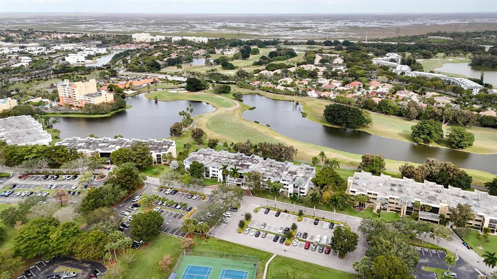 16251 Golf Club Road, Unit 305 Weston, FL 33326 - Photo 30 of 43 an aerial view of residential houses with outdoor space
