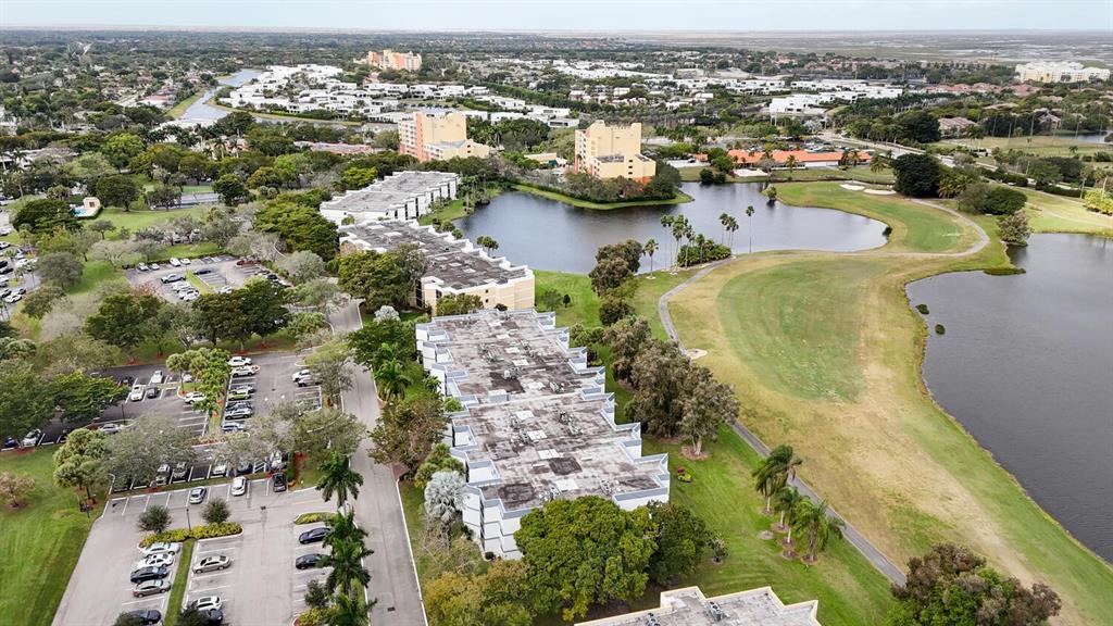 16251 Golf Club Road, Unit 305 Weston, FL 33326 - Photo 32 of 43 an aerial view of residential houses with outdoor space