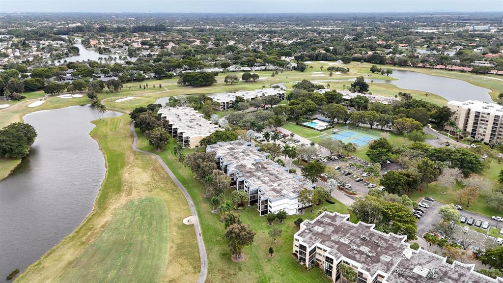 16251 Golf Club Road, Unit 305 Weston, FL 33326 - Photo 36 of 43 an aerial view of residential houses with outdoor space