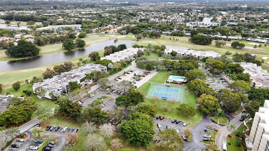 16251 Golf Club Road, Unit 305 Weston, FL 33326 - Photo 38 of 43 an aerial view of residential houses with outdoor space and lake view