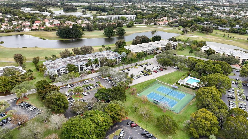 16251 Golf Club Road, Unit 305 Weston, FL 33326 - Photo 39 of 43 an aerial view of lake residential houses with outdoor space and swimming pool