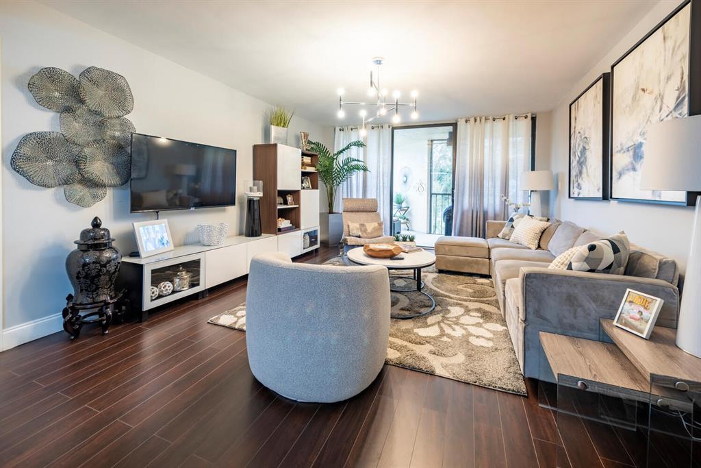 16251 Golf Club Road, Unit 305 Weston, FL 33326 - Photo 4 of 43 a living room with furniture and a flat screen tv