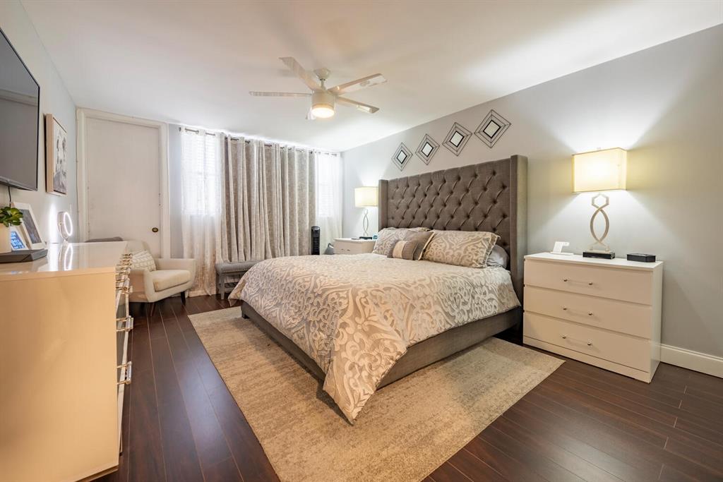 16251 Golf Club Road, Unit 305 Weston, FL 33326 - Photo 7 of 43 a bedroom with a large bed and a chandelier